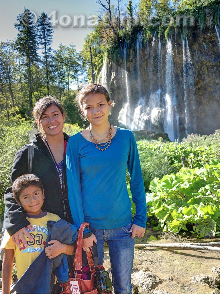 Family posing by waterfall in Plitvice NP