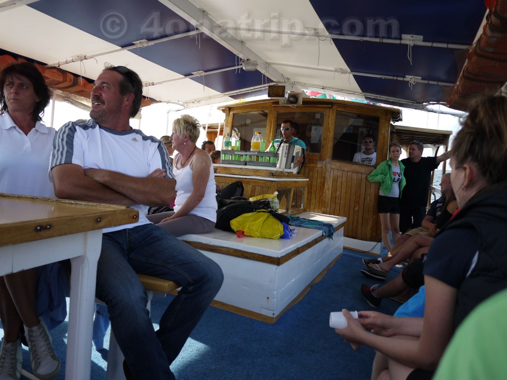 Playing accordian on boat