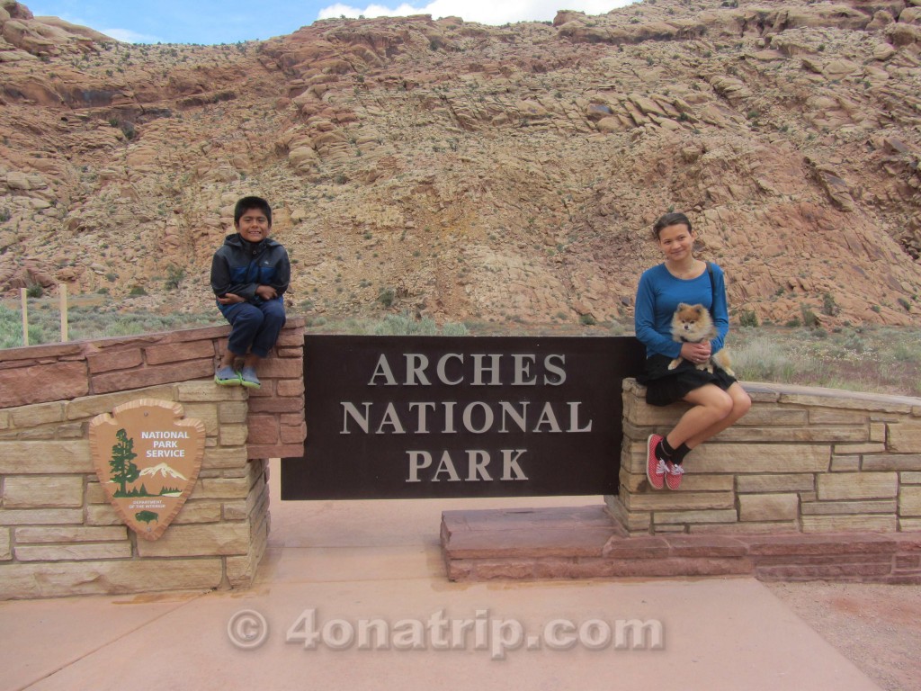 Arches National Park sign with kids